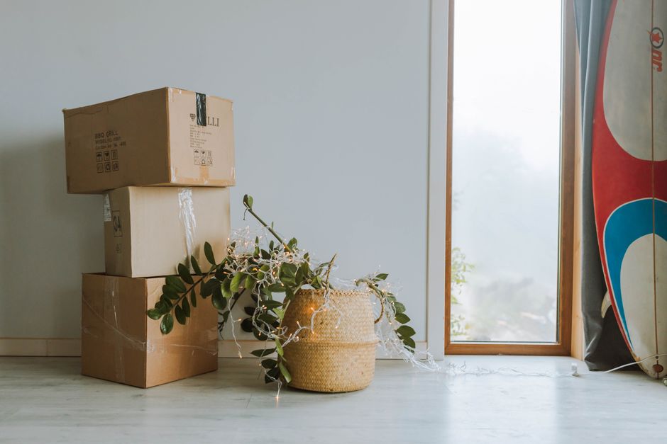 Family happily unpacking boxes in their bright new living room